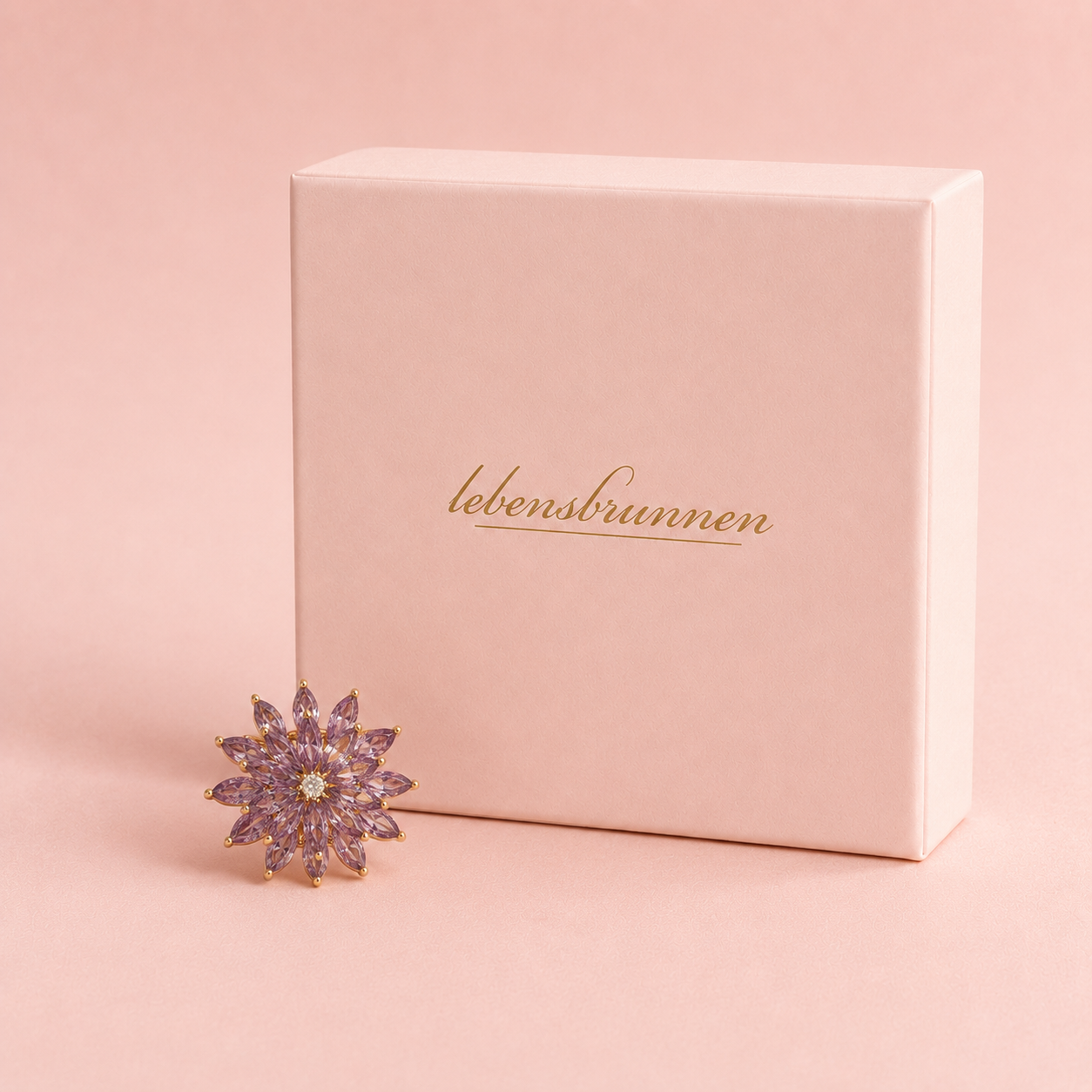 Drehbare Blumen Brosche mit violetten Zirkonia – vergoldet, 29 mm